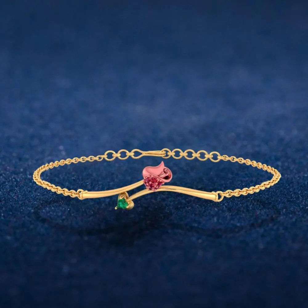 A 18k Gold Bracelet Featuring A Green Stone And A Yellow-shaped Design