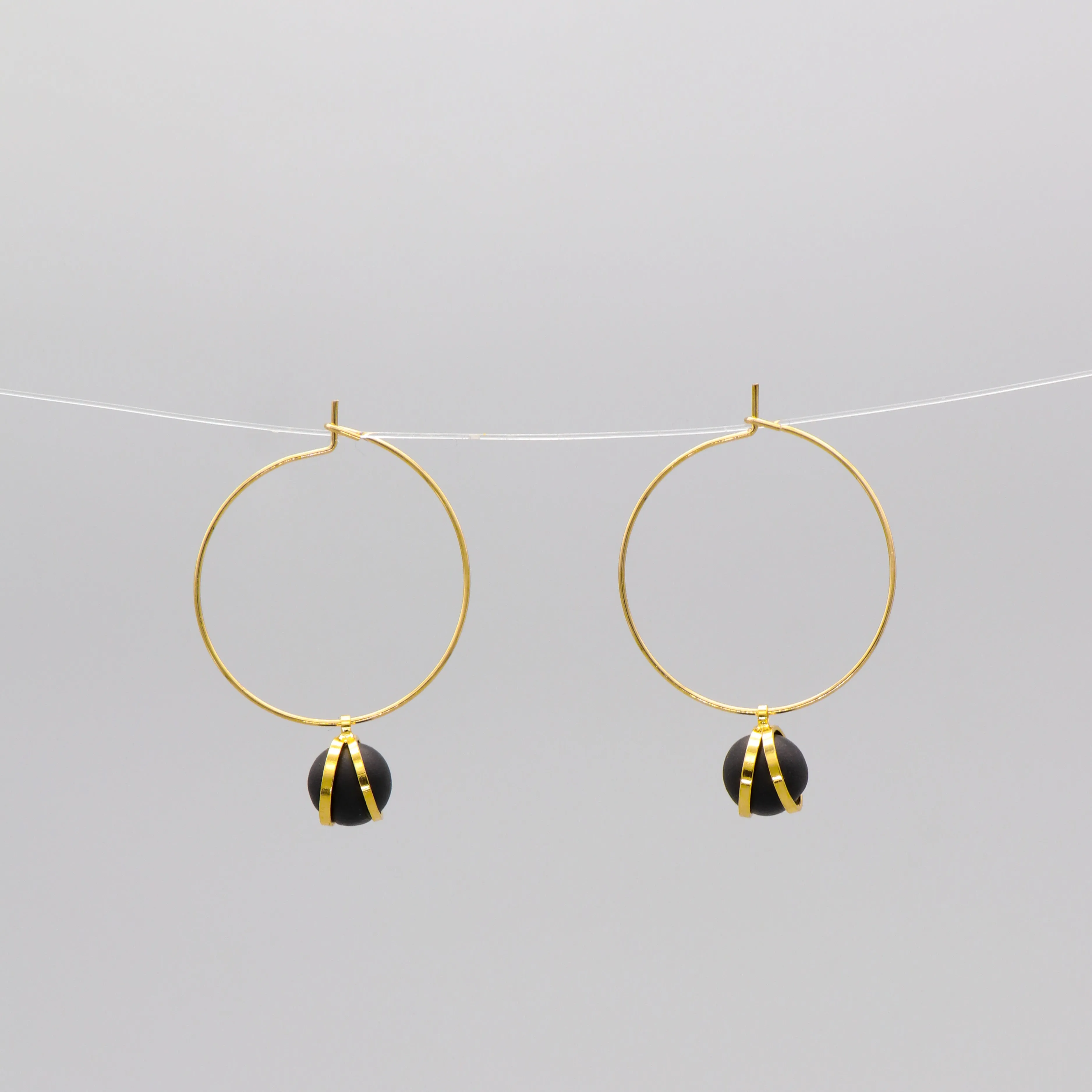 Caged ball charm gold hoop earrings